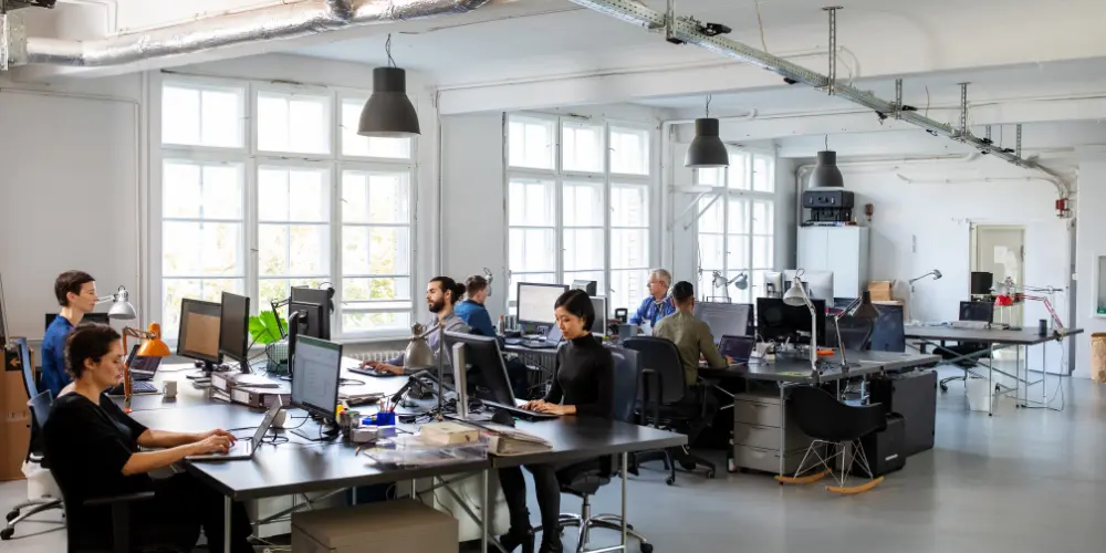 large game development team working in open office