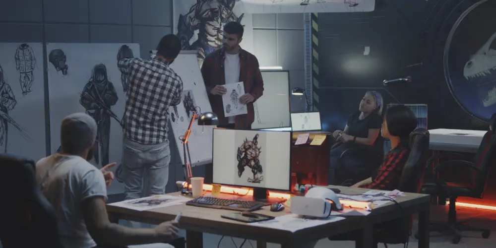 game development outsourcing team collaborating on concept art